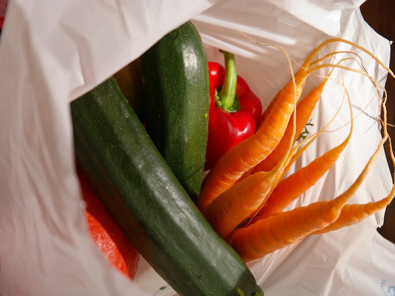 Plastic bag holding vegetables