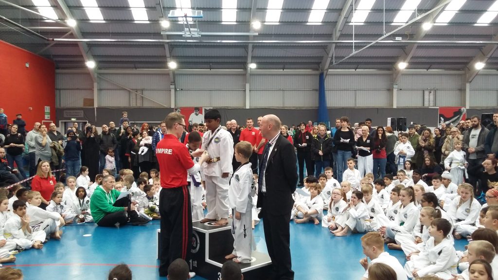 Little Dragons receiving their medals for the high kick and flying kick categories