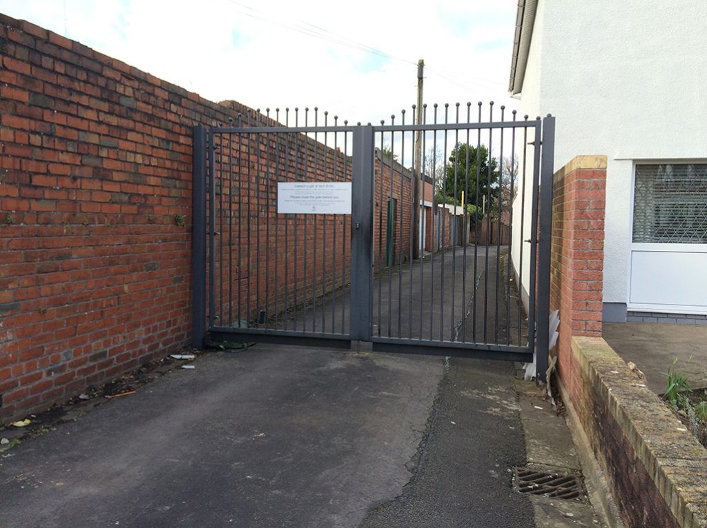 A steel gate blocking public access to a back lane in Penylan.