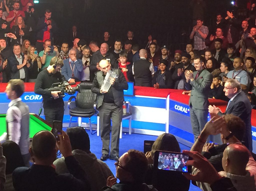 Bingham kisses the Ray Reardon trophy after a 9-8 triumph in the Welsh Open final. Reardon (right) watches on.
