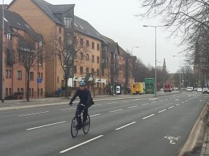 A cyclist commuting into the city centre on Newport Road.