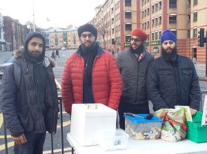 The volunteers serving up food to the homeless. From left to right: Prem Singh Gill, Gurraj Singh, Alvin Dev Singh, Amerpreet Singh Khalsa.