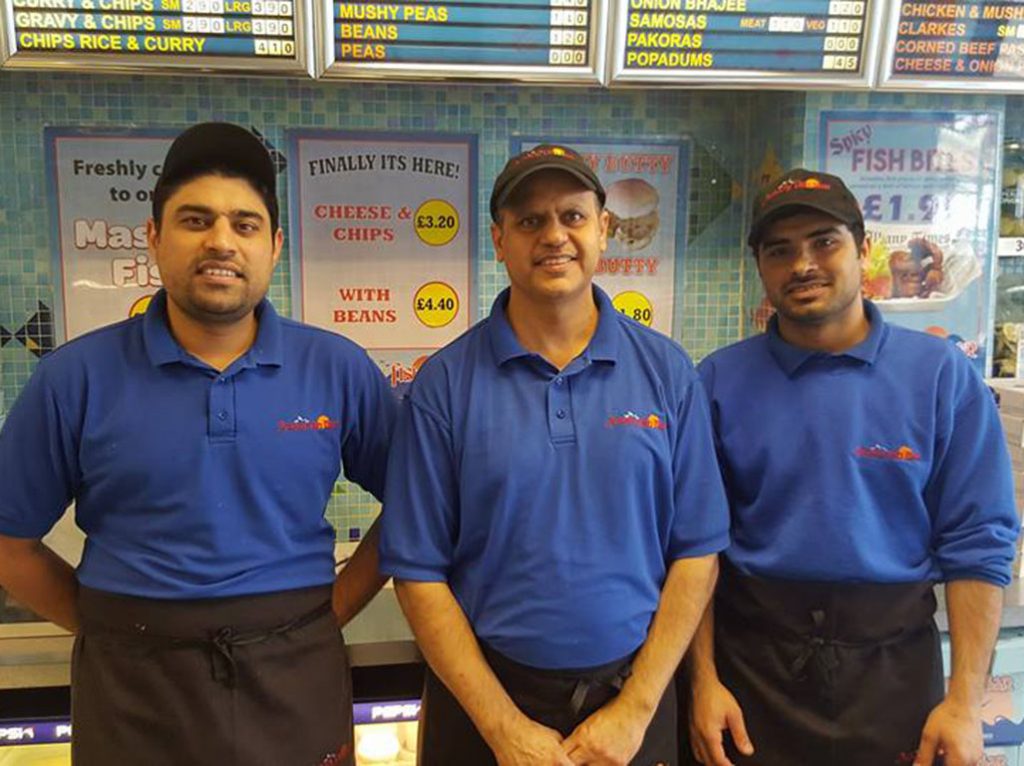 Tariq Siddique (centre) with some of his team
