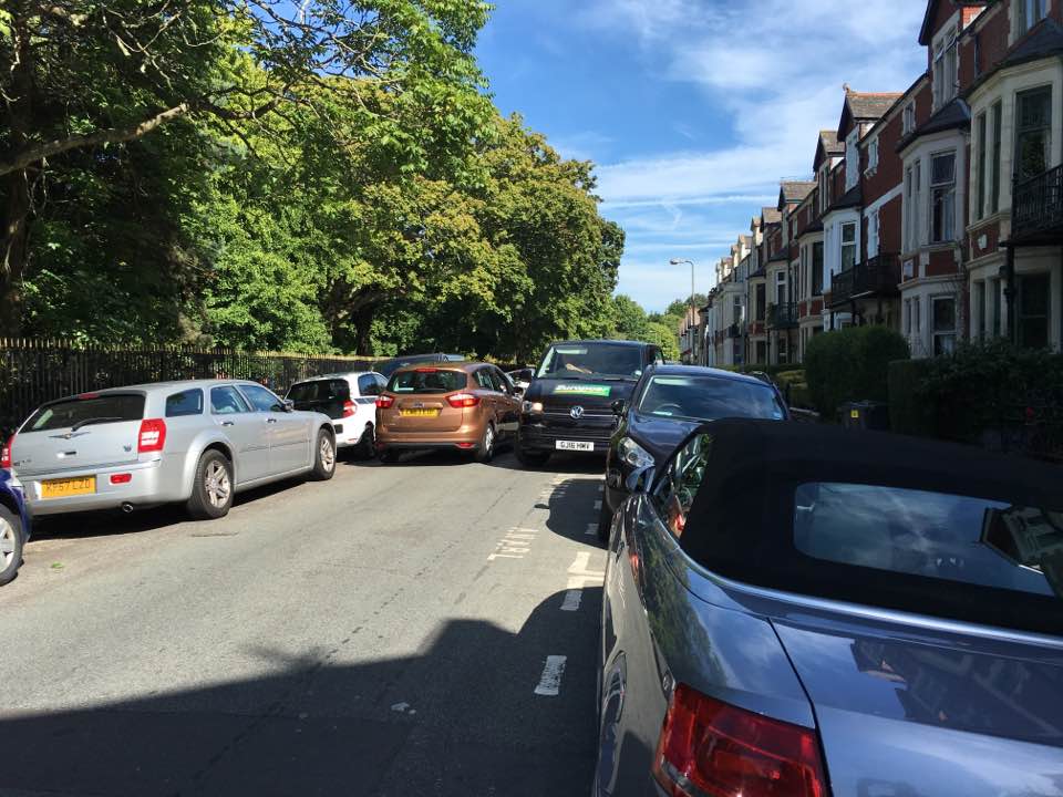 Cars are stuck in a long queue of traffic near Victoria Park
