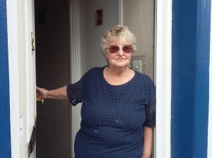 Mrs Annette Leigh-Bennett at her doorstep on Planet Street.