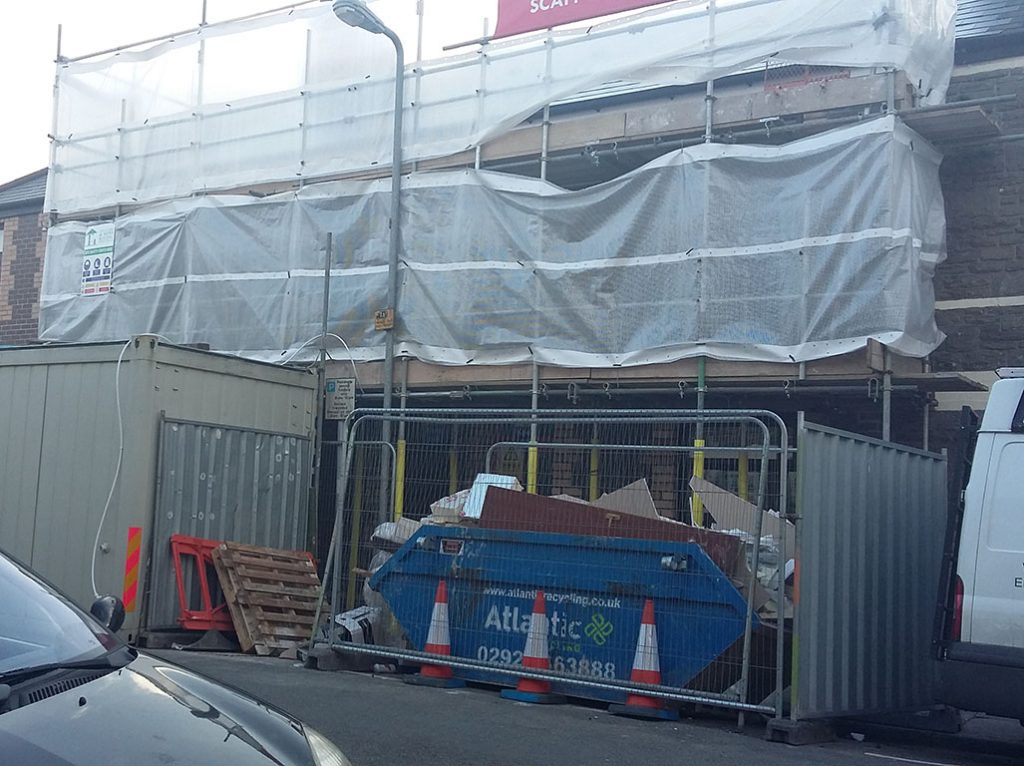 Scaffolding and skips on Coburn Street take up parking space for at least two cars.