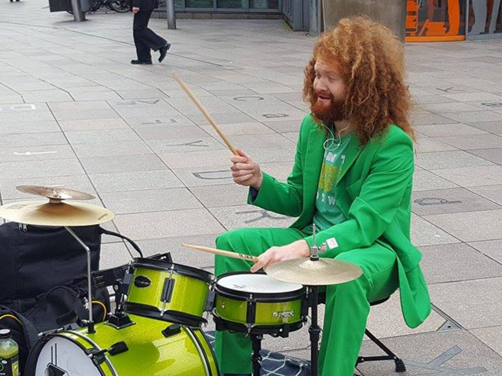 A street drummer entertaining the crowds who have already started to gather in Cardiff.