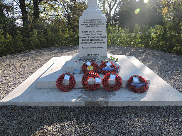 Poppy wreaths laid on the war memorial