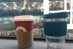A single use cup and a reusable cup