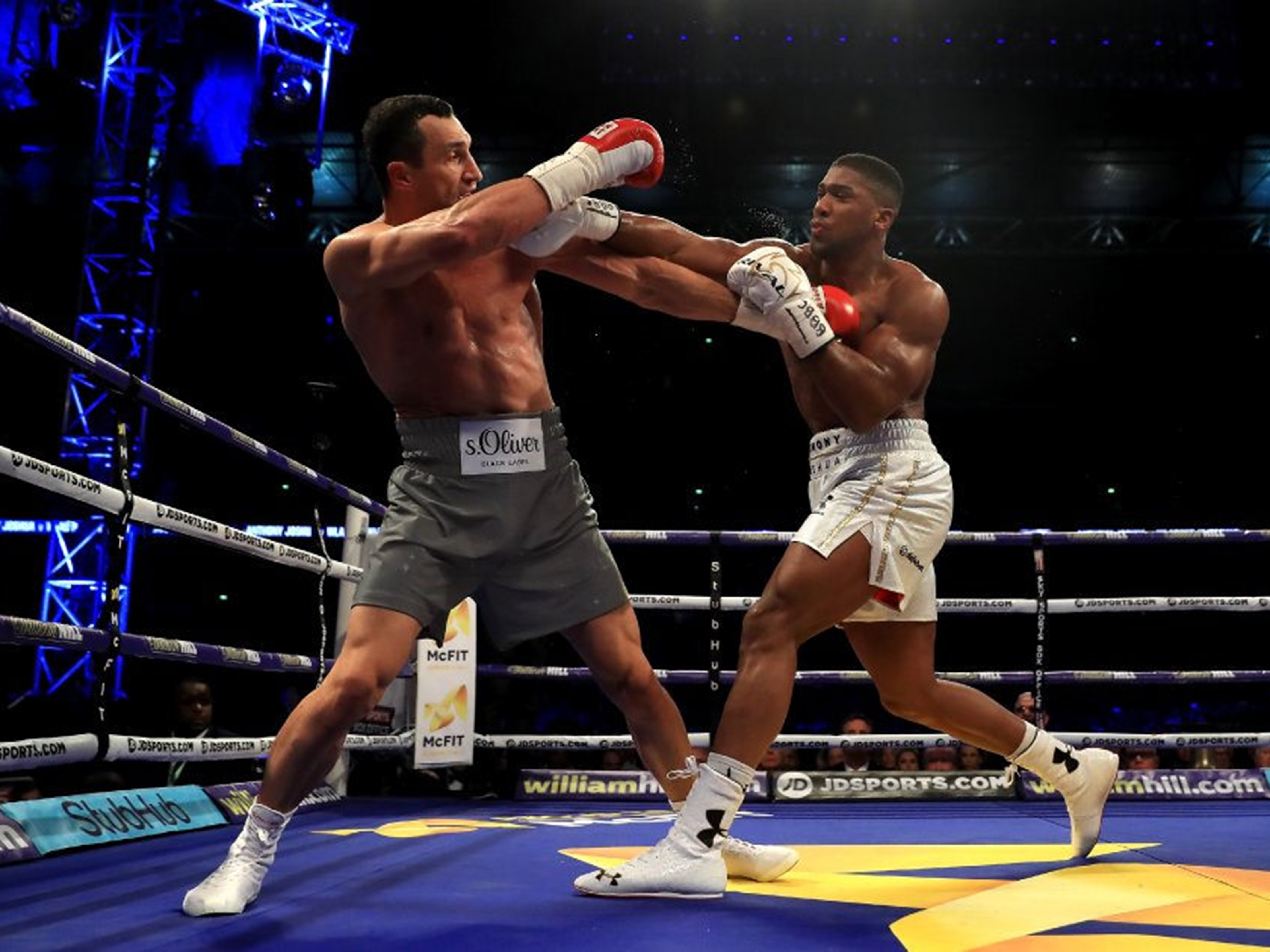 Joshua throws a punch at Kitschko duiring their heavyweight bout last April